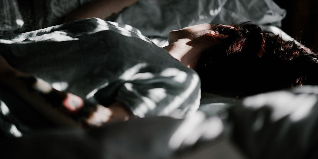 Person sleeping with dim lighting
