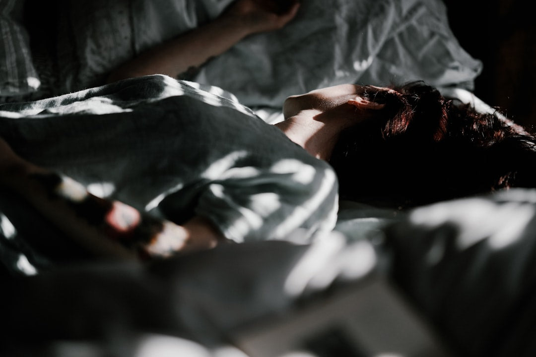 Person sleeping with dim lighting