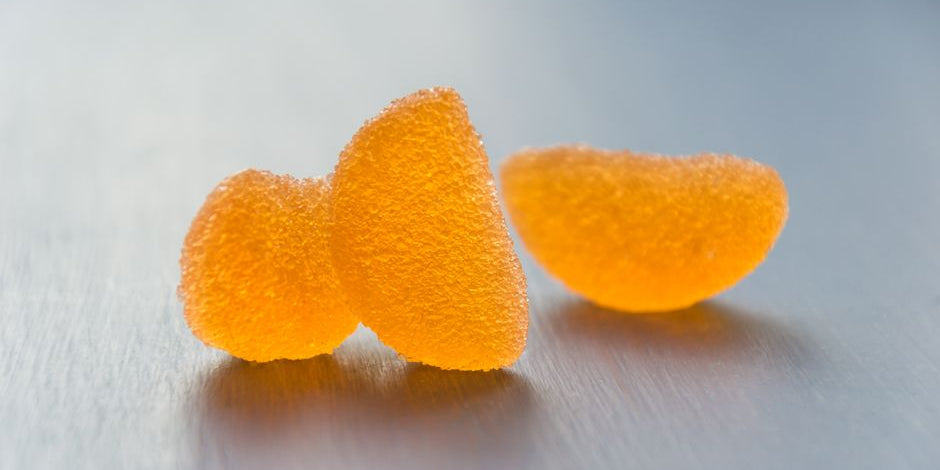 Three sugar coated orange jelly candies
