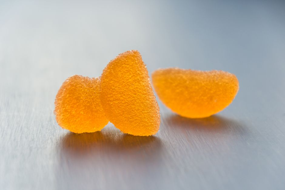 Three sugar coated orange jelly candies