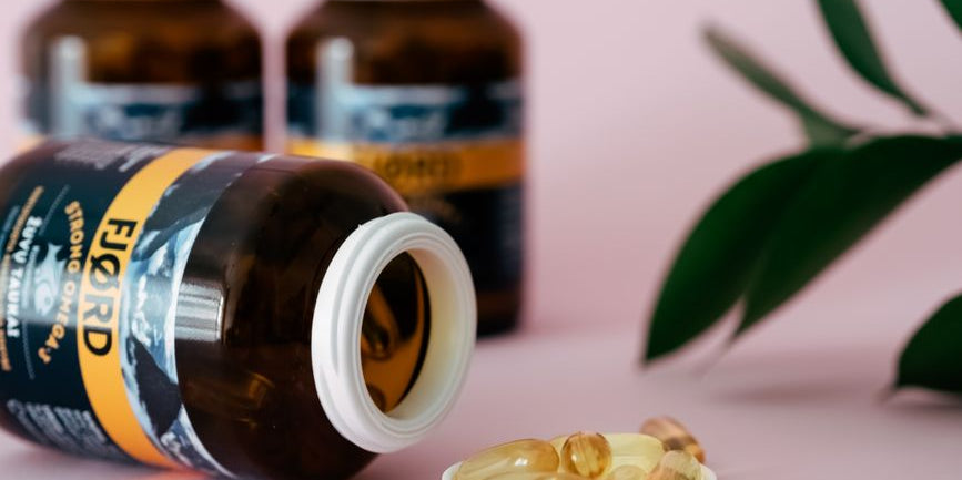 Open fjord fish oil bottle with capsules