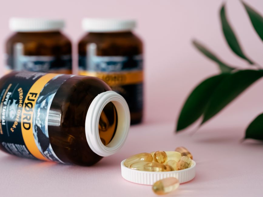 Open fjord fish oil bottle with capsules