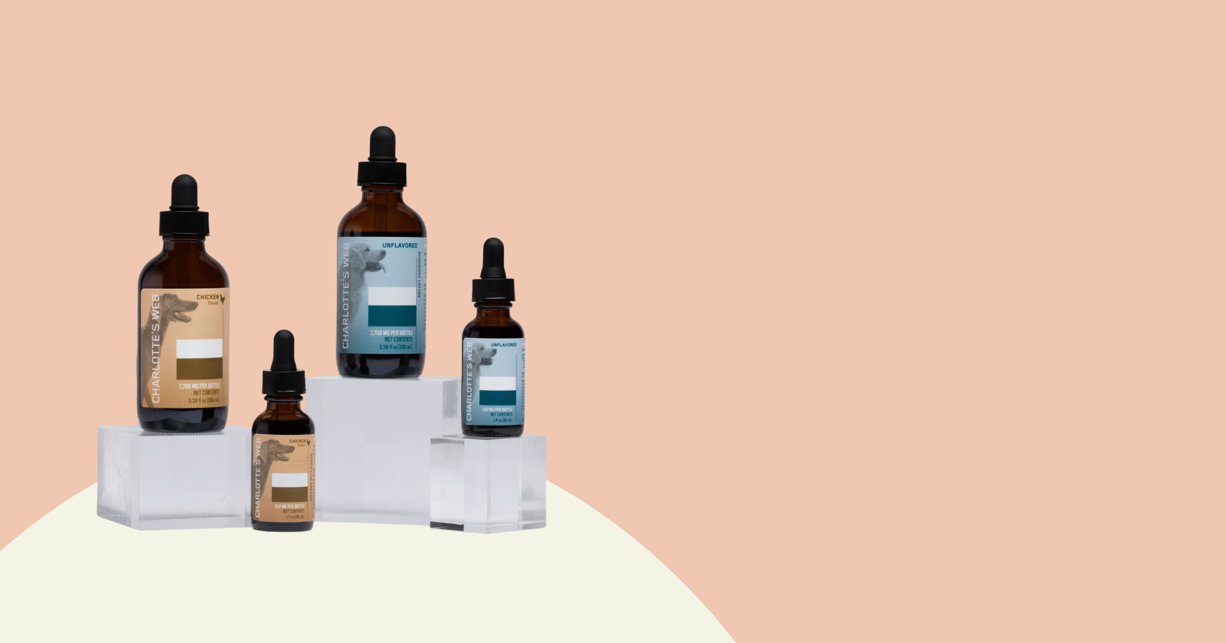 Set of skincare bottles on a white stand with a pink background