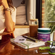 Product Image for Person sitting at a table with a jar of coffee, phone, notebook, and a container labeled &#39;Focus &amp; Attention&#39; in a cozy indoor setting.