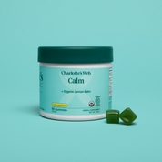 Product Image for Jar of Charlotte&#39;s Web Calm gummies with a green lid on a teal background