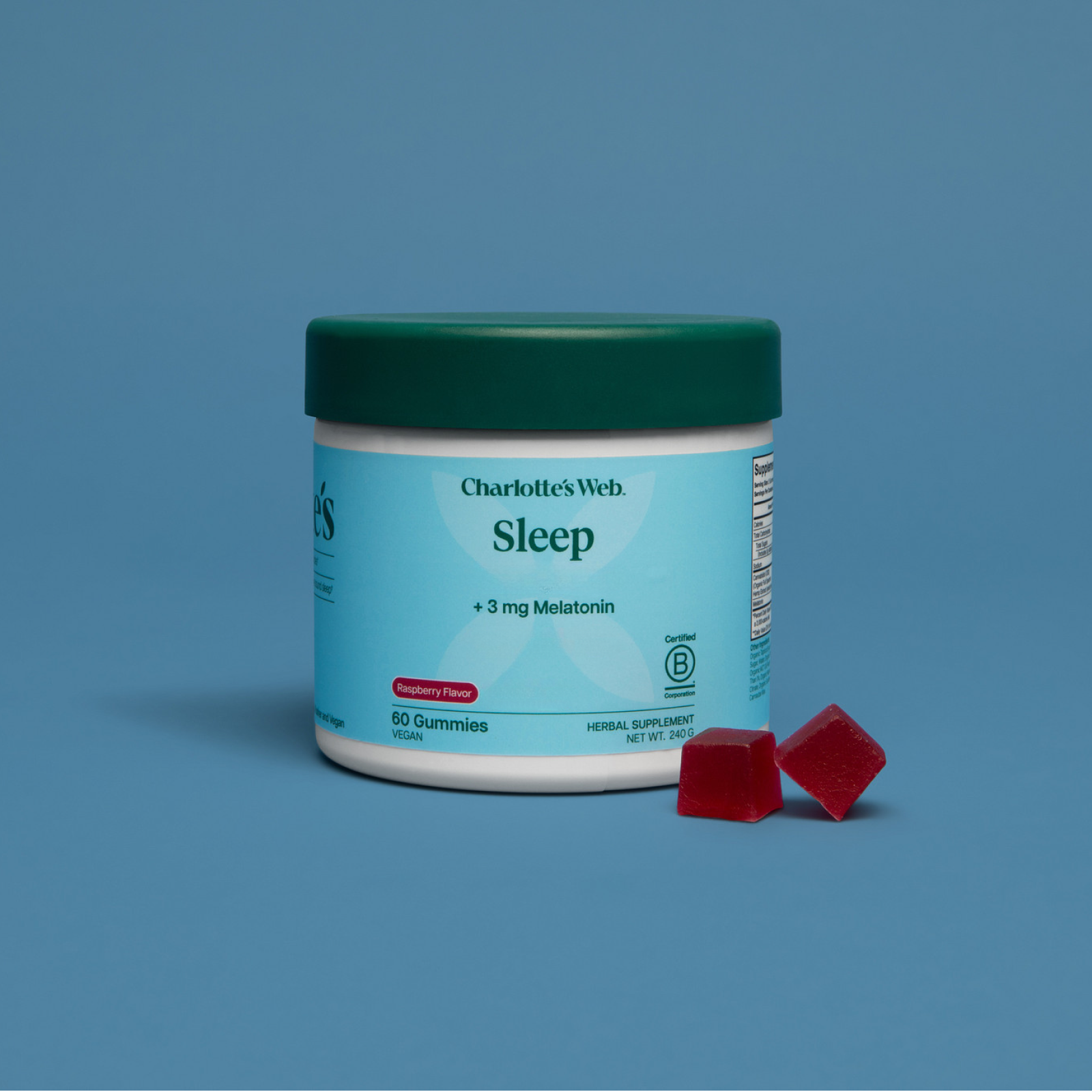 Product Image for Jar of Charlotte&#39;s Web Sleep gummies with two red gummies on a blue background