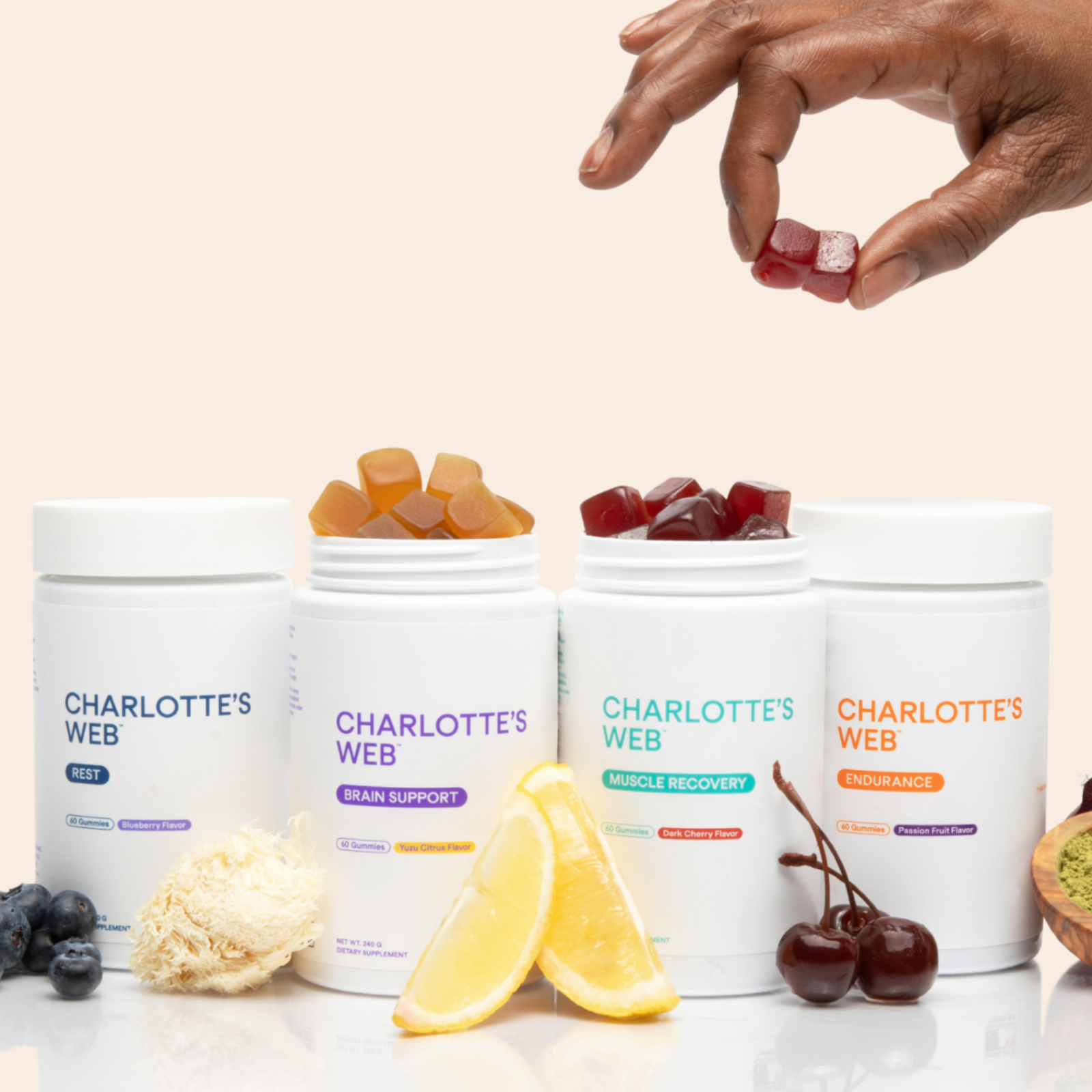 Charlotte's Web gummy bears with product containers on a light background