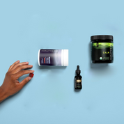 Product Image for Three Charlotte&#39;s Web products on a blue background with a hand reaching towards one of them.