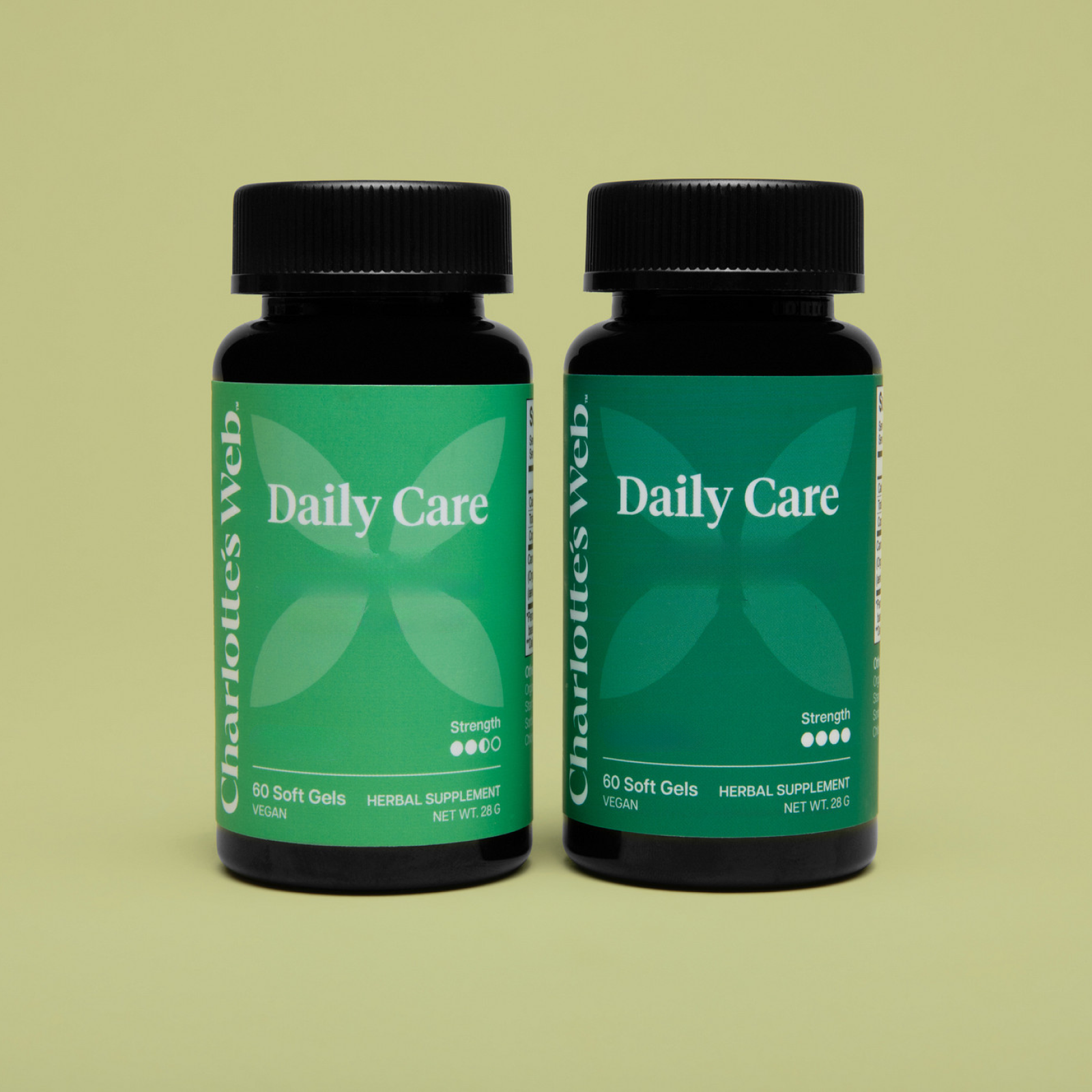 Product Image for Two bottles of Charlothes Web Daily Care supplement on a green background