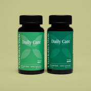 Product Image for Two bottles of Charlothes Web Daily Care supplement on a green background
