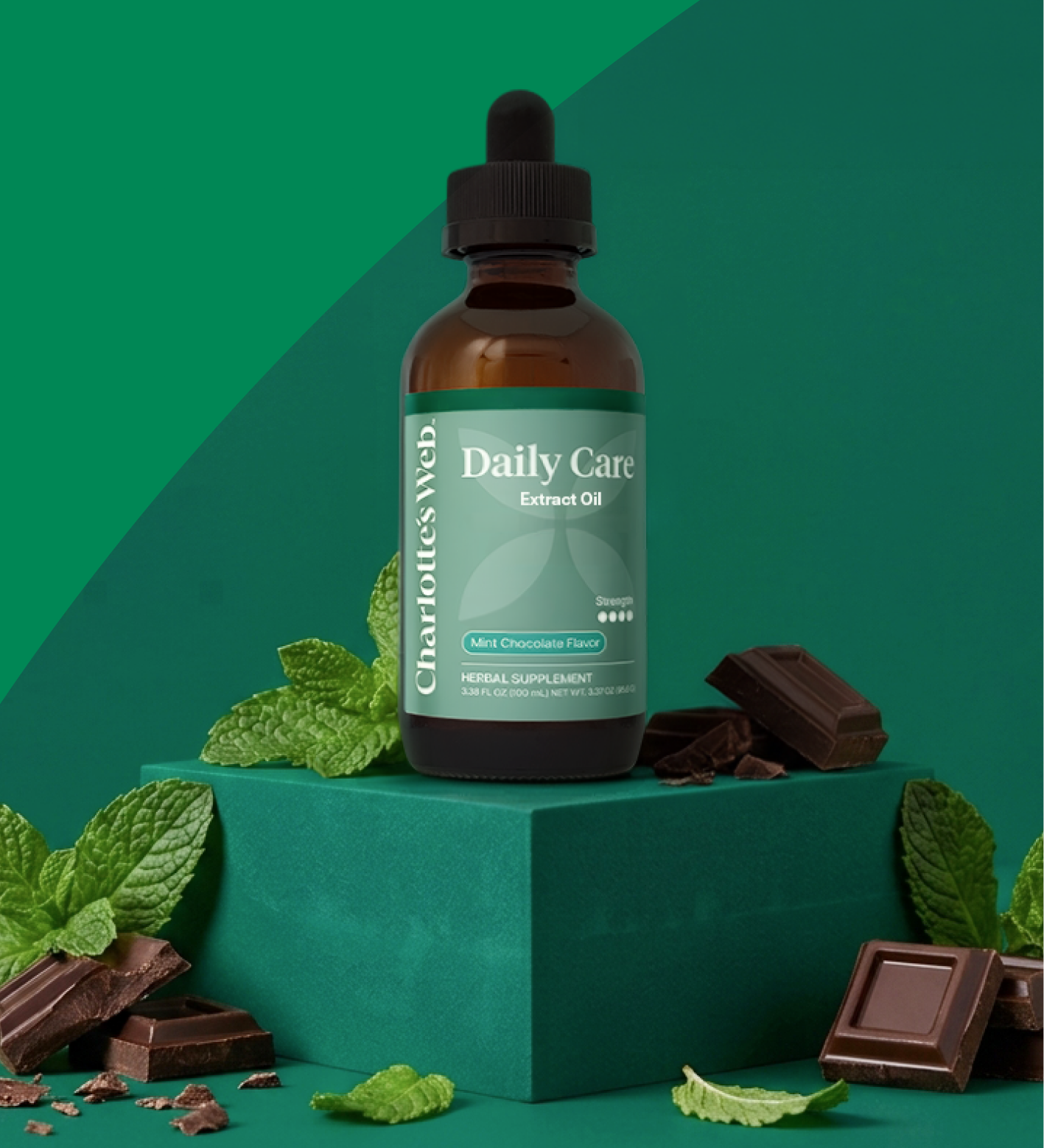 Daily Care 60 mg broad-spectrum hemp extract oil with mint leaves and chocolate pieces on a green background