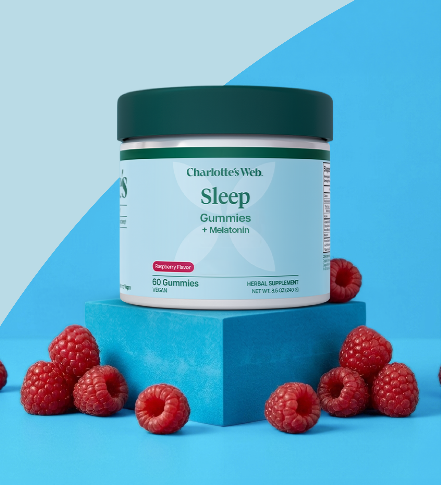 Charlotte's Web Sleep gummies with 25mg broad-spectrum hemp on a blue background with raspberries