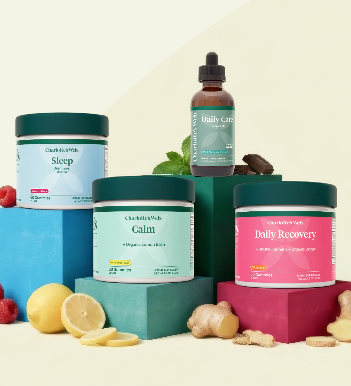 Charlotte's Web broad-spectrum hemp products for Sleep, Calm, Recovery, and Daily Care Oil with raspberries, lemons, ginger, and chocolate pieces.