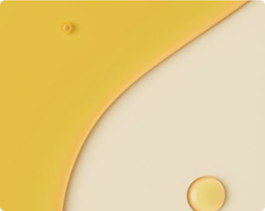 Close-up of oil on a beige surface