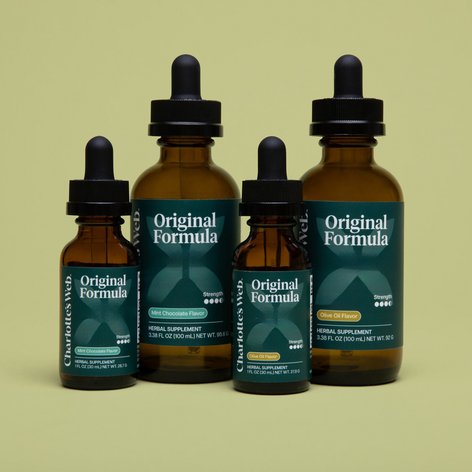 Product Image for Four bottles of Charlotte&#39;s Web Original Formula herbal supplement on a light green background