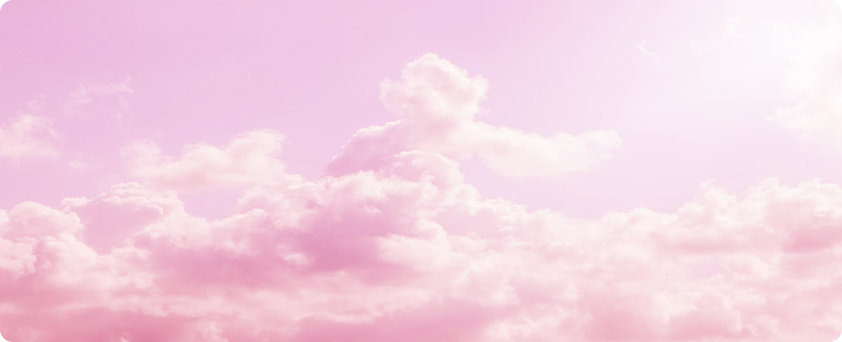 Pastel pink sky with fluffy clouds
