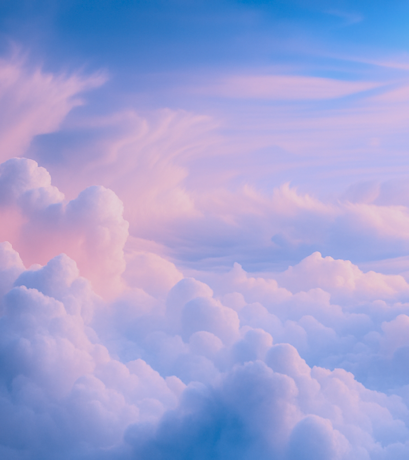 Pastel-colored clouds in a soft blue and pink sky