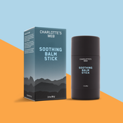 Product Image for Charlotte's Web Soothing Balm Stick on a stylized diagonal split background of light blue and orange.