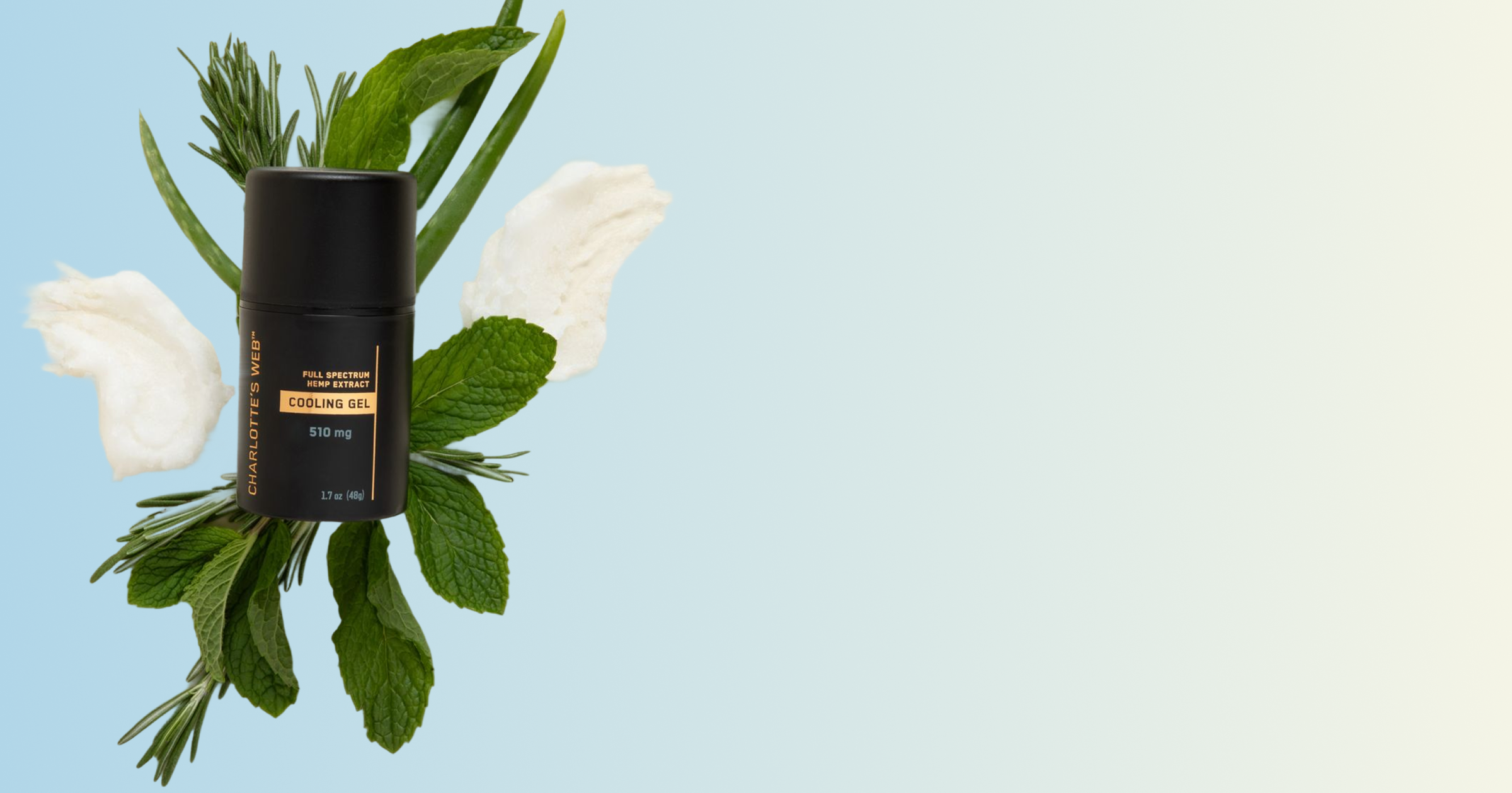 Black cylindrical product with gold text on a light blue background with white flowers and green leaves.